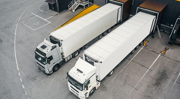 trucks are parking near warehouse trucks
