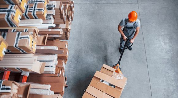 workers placing goods in warehouse workers in warehouse working